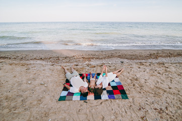 Family with a daughter on the beach