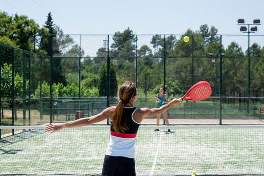Two women playing padel outdoor