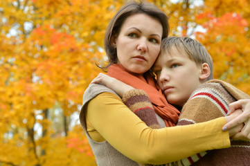 Mother with son in autumn park