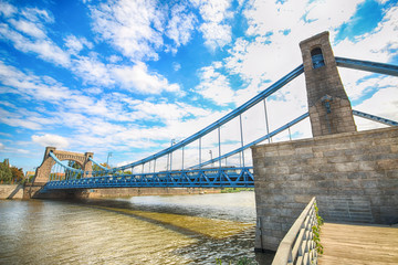 Fototapeta premium WROCLAW, POLAND - AUGUST 14, 2017: Grunwald Bridge (Most Grunwaldzki) is a suspension bridge over the river Oder in Wroclaw, built between 1908 - 1910. Designed by Richard Pluddemann.