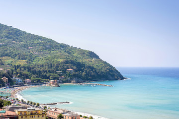 Beautiful daylight view to green mountains, blue sea and buildings of Levanto, Italy. Cinque Terre beauties