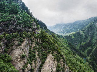 Carpathians nature landscape of rocky Fagaras mountains in cloudy weather at Romania, spectacular wilderness scenery