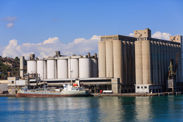 Freight shipping operation on the coast of Barcelona, Spain © dbvirago