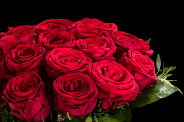 Bouquet of red roses on a black background