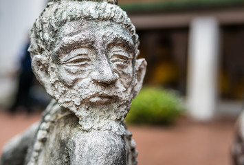 spinning hermit statue made of marble in Thailand