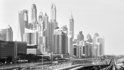 Naklejka premium Old black and white film style picture of Dubai skyline.