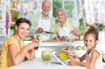 Mother and daughter having breakfast