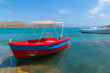 Naklejka na ściany i meble Fishing boats at the coast of Crete, Greece