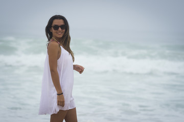 Young female posing looking at camera on the beach