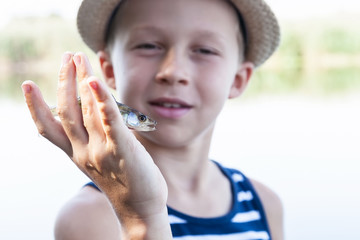 Boy holding a fish fry