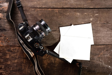 SLR camera on wooden background