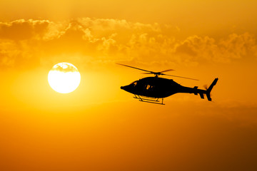 Helicopter sunsets silhouette
