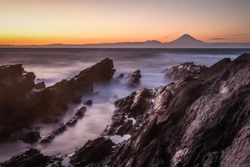Naklejka na ściany i meble Japan seascape and Mt. Fuji in sunset. Seen from Jogashima island , Kanagawa prefecture. Jogashima is a small island off the south coast of Miura peninsula.