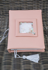 Handmade pink leather notebook with decoration like shaker with paillettes and tassel