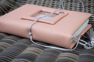 Handmade pink leather notebook with decoration like shaker with paillettes and tassel