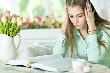 Fototapeta premium woman reading interesting book