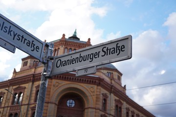 Berlin, Germany - August 13, 2017: Oranienburger Strasse street name sign. Oranienburger Strasse is a street in central Berlin, located in the borough of Mitte, north of the River Spree