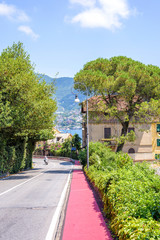 Beautiful daylight view to a road with biker in Rapallo city, Italy.