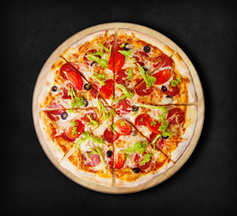 Pepperoni pizza on a black background. Visit my page. You will be able to find an image for every pizza sold in your cafe or restaurant 