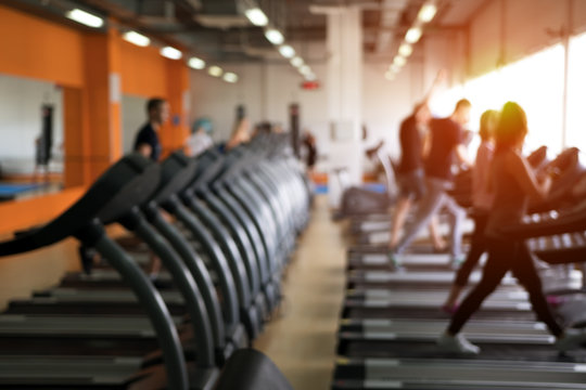 Row Of Treadmills In Modern Fitness Center.