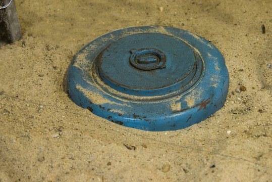 Close Up On Land Mine In The Sand