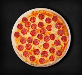 Photo sur Plexiglas Pizzeria Pepperoni pizza on a black background. Visit my page. You will be able to find an image for every pizza sold in your cafe or restaurant 