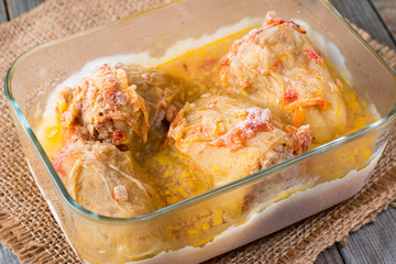 Stewed frozen stuffed pepper in a glass container. Frozen food