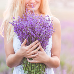 Fototapeta premium Beautiful girl on the lavender field
