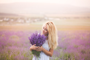 Beautiful girl on the lavender field