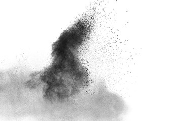 particles of charcoal splatted on white background