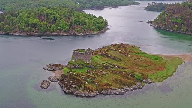 Aerial view of the old ruined Castle in the Highlands of Scotland - Long distance flight part 03