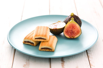 Fig cookies on white wooden table
