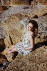 Beautiful pregnant woman on a walk in nature