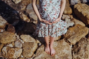 Beautiful pregnant woman on a walk in nature