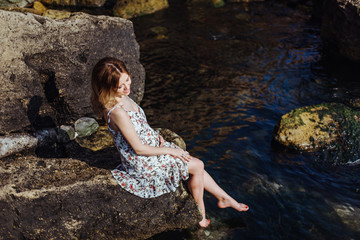 Beautiful pregnant woman on a walk in nature