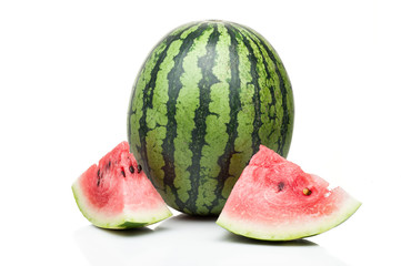 watermelon with one slice standing isolated on white background