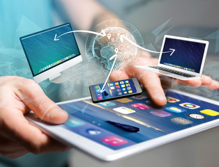 Computer and devices displayed on a futuristic interface with interantional network - Multimedia and technology concept