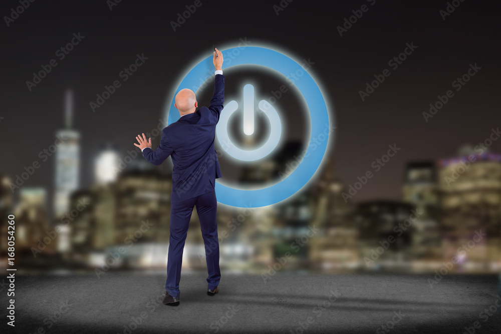 Poster businessman in front of a wall with power button symbol displayed on a futuristic interface - techno