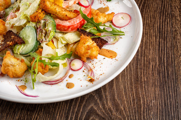 salad with fresh vegetables grilled veal and baked potatoes