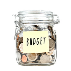 Savings money box coins thai baht with empty yellow stick note paper isolated on white background. Jar for savings full of coins. Piggy bank for saving money template for text. Close up. Front view.