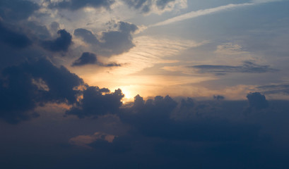 sunset sun against the clouds