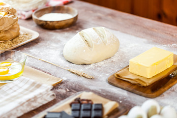 fresh dough on kitchen  rustic wooden table.