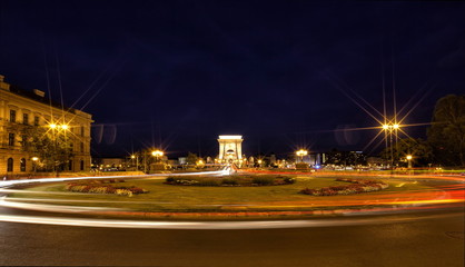 Chain Bridge in Budapest at night with roundabout.