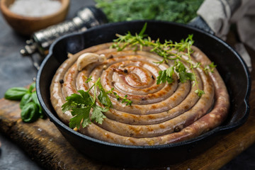 Barbeque sausages on cast iron pan