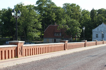 Countryside bridge view of brick road.