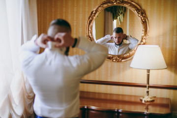 Groom in the morning going to the wedding