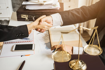 The hard work of an asian lawyer in a lawyer's office. Counseling and giving advice and...