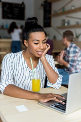 african american girl using laptop
