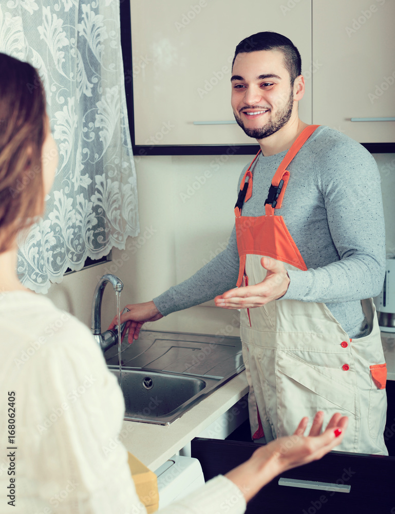 Poster Repairman and housewife at kitchen