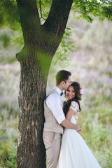 Fototapeta premium Beautiful bride and groom couple walking at the wedding